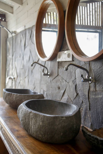 istock Simple contemporary bathroom in boho style. Small budget-friendly powder room in beachy boho chic vibes. 1226241342