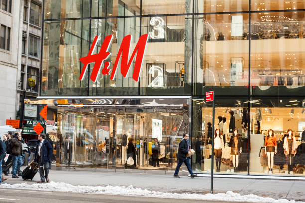 H&M New York City New York, New York, USA - January 27, 2016: H&M on Fifth Avenue in Midtown Manhattan. H&M is a large clothing retailer. People can be seen. h and m stock pictures, royalty-free photos & images