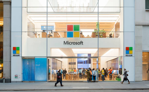 The Microsoft Store New York City New York, New York, USA - January 27, 2016: People walk by the Microsoft Store on Fifth Avenue in Midtown Manhattan. microsoft stock pictures, royalty-free photos & images