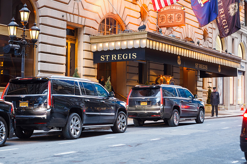 New York, New York, USA - January 27, 2016: The St. Regis Hotel on 55th street off Fifth Avenue in Manhattan. SUV's can be seen in front of this longstanding luxury hotel in New York City.