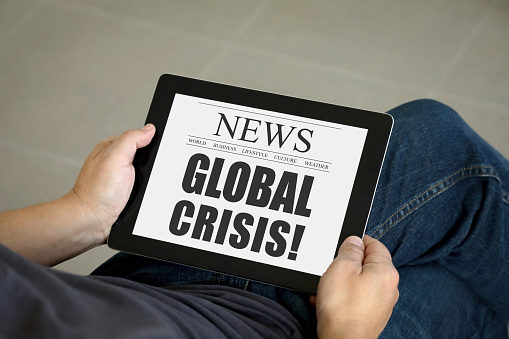 Global crisis internet news tablet