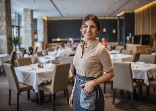istock Waiter Serving  Drinks And Food In Restaurant 1226242438