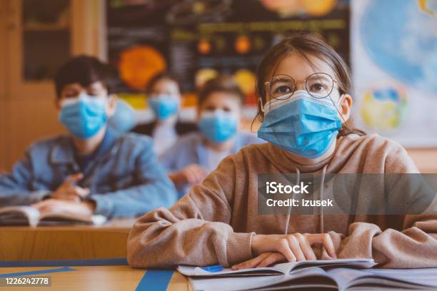 Teenage Girl Wearing N95 Face Mask At School Stock Photo - Download Image Now - Protective Face Mask, School Building, Education