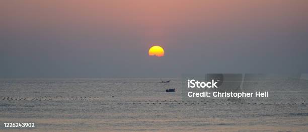 Sunset Over The Beach At Mũi Né Beach Resort In Vietnam Stock Photo - Download Image Now