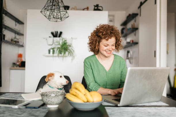 istock Beautiful young woman setting up her home office 1226246171