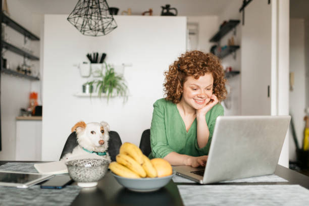 istock Beautiful young woman setting up her home office 1226246197