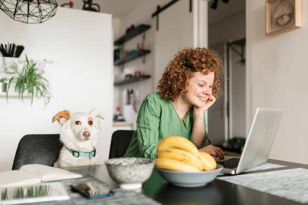 istock Beautiful young woman setting up her home office 1226246244