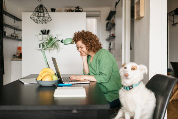 istock Beautiful young woman setting up her home office 1226246279
