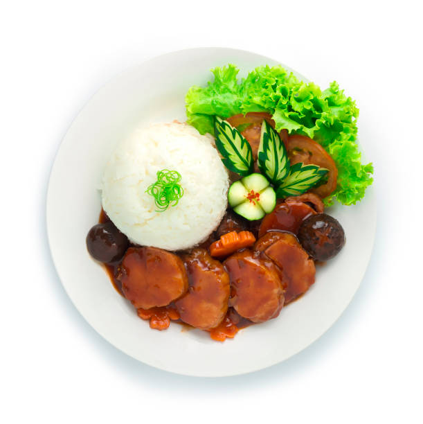 Smoke Chicken Ham and Red Sauce Served with Rice Recipe ontop Bunching spring onion cutlet,Carved stock photo