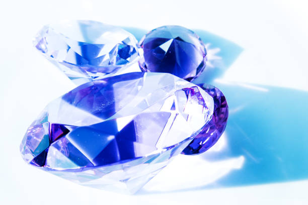 istock close-up of blue shiny diamonds on white background 1226246981