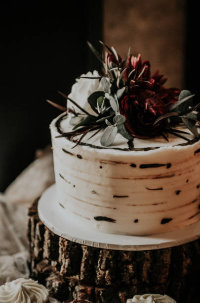 Dessert anyone? Wedding reception dessert table with cake, cupcakes, and more! white wedding cake red roses stock pictures, royalty-free photos & images