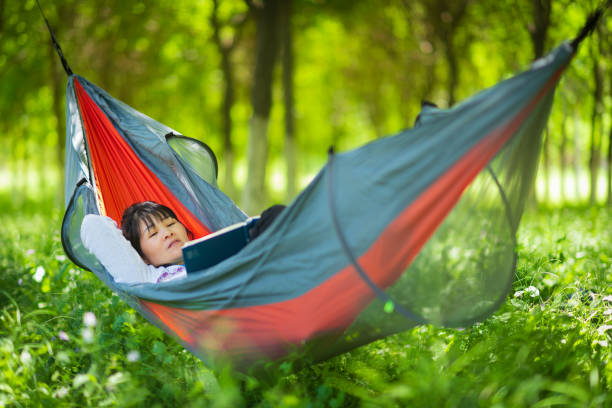 istock Asian women are very comfortable reading in hammocks 1226251532