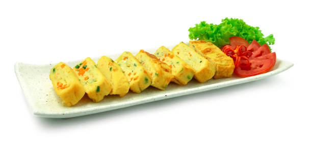Korean Rolled Egg recipe Gyeran Mari is made with chopped carrot and scallion. stock photo