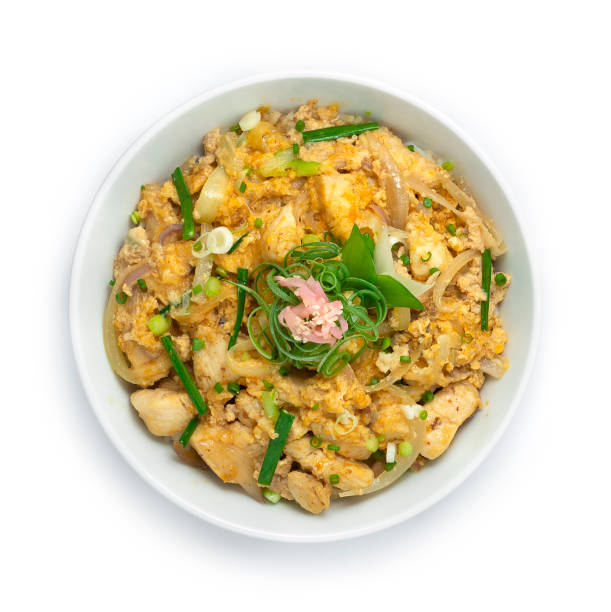 Oyakodon Chicken with Egg,spring onions ontop Rice Recipe and Pickled ginger and Bunching onion cutlet Japanese food traditional Rice Bowl cooking style topview