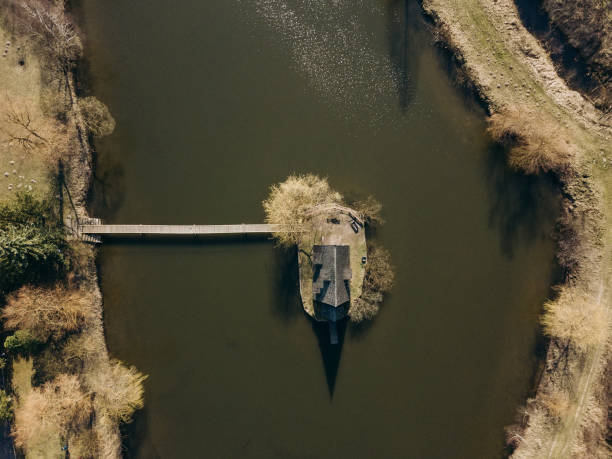 istock Aerial top view with drone Old house on a forest lake 1226255121
