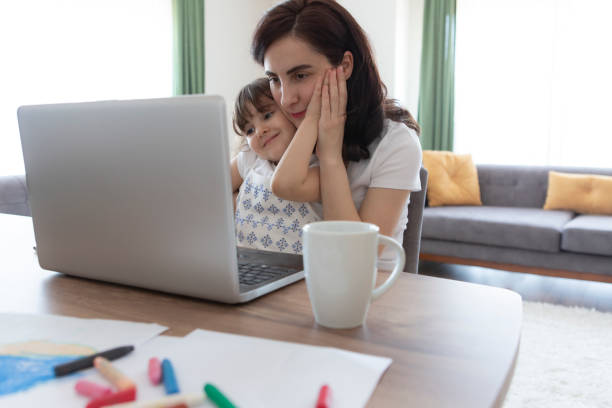 istock Young mother working and spending time with her daughter 1226256840
