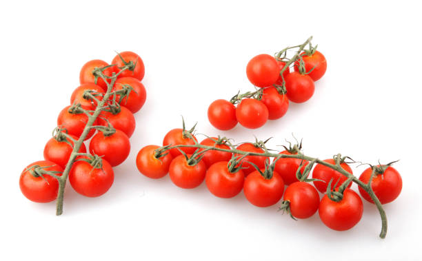 istock Fresh organic cherry tomatoes isolated on white background 1226256870