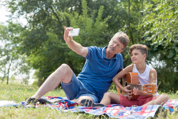 istock Senior man taking selfie with grandson 1226257174