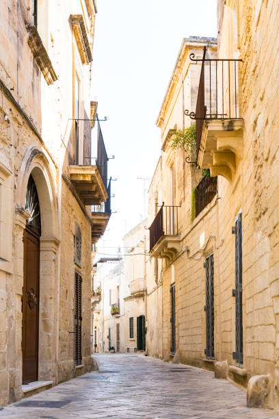 istock empty narrow street in historical town Lecce, Italy 1226257287