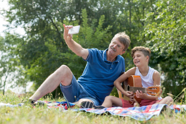istock Older man taking selfie with grandson 1226257874