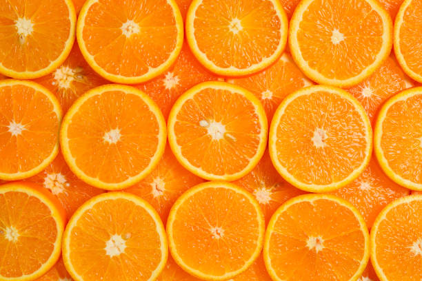 istock Slices of oranges as a background, top view. 1226258592