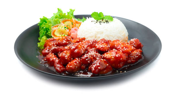 Dakgangjeong Fried Chicken with Spicy and Sweet Sauce  Sprinkle Sesame Served Rice Traditional Korean Food stock photo