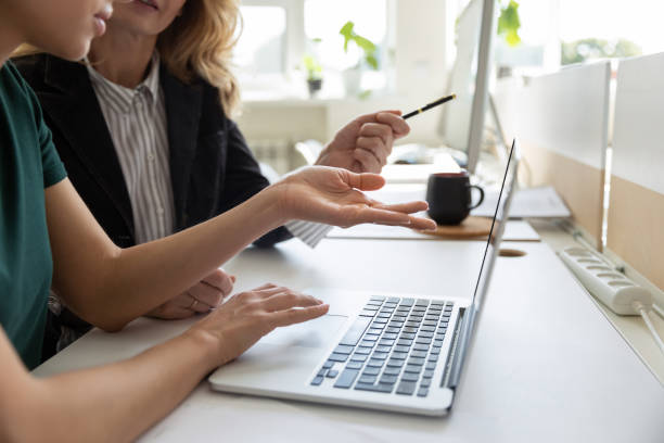 istock Female coworkers cooperate discussing ideas using laptop 1226261512