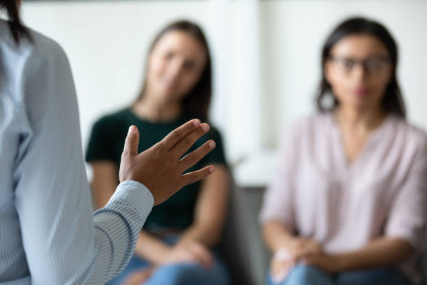 istock Confident female speaker lead meeting with diverse colleagues 1226261581
