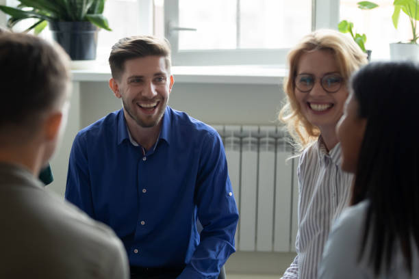 istock Overjoyed diverse people have fun engaged in team therapy indoors 1226261583