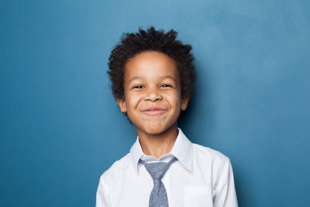 istock Happy black child boy on blue background 1226261689