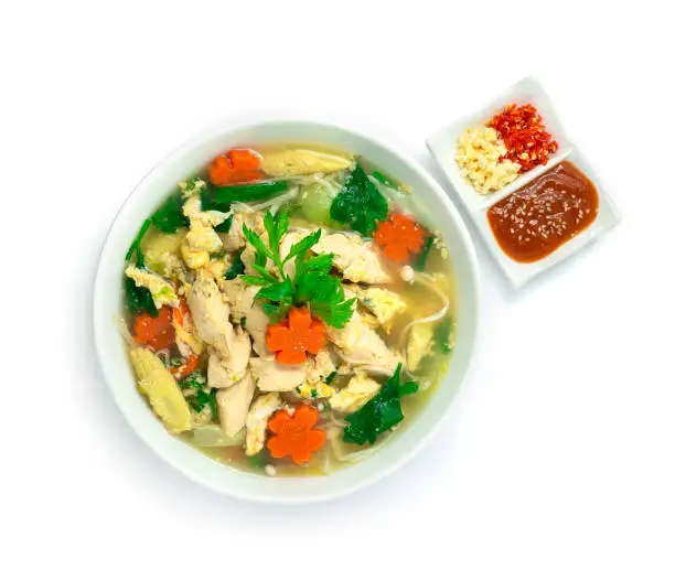 Thai Sukiyaki Soup with Chicken,Egg and Vegetables Carved Carrots flowers shape  served Sauce ,chili and garlic  Asian Food fusion Style  Popular Street Food Goodtasty Healthy Delicious diet hot dish topview