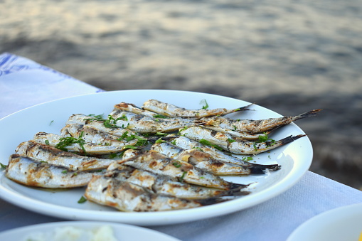 Plate of freshly cooked fish on the table
