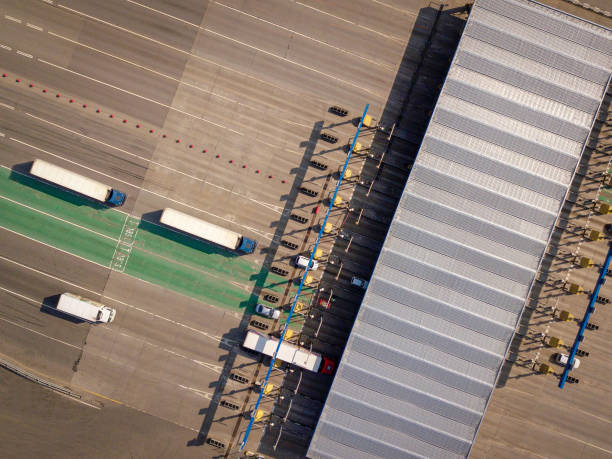 Aerial top down drone shot. Highway traffic. Turnpike terminal