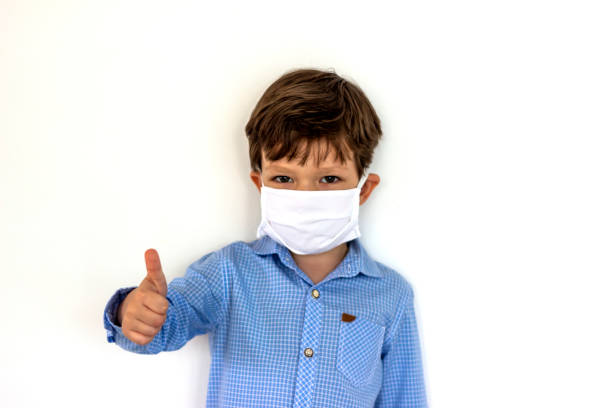 istock Boy wearing medical mask protection 1226266880