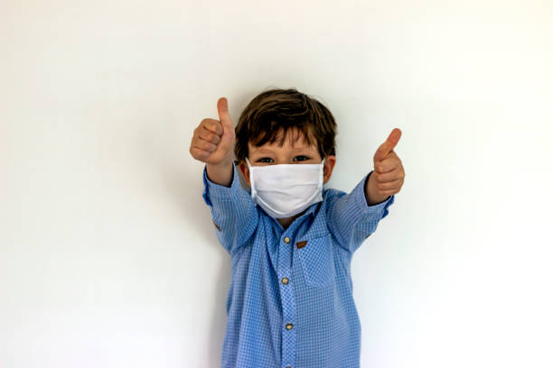 istock Boy wearing medical mask protection 1226266884