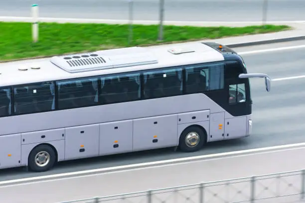 Large comfortable long-distance bus rides on the highway