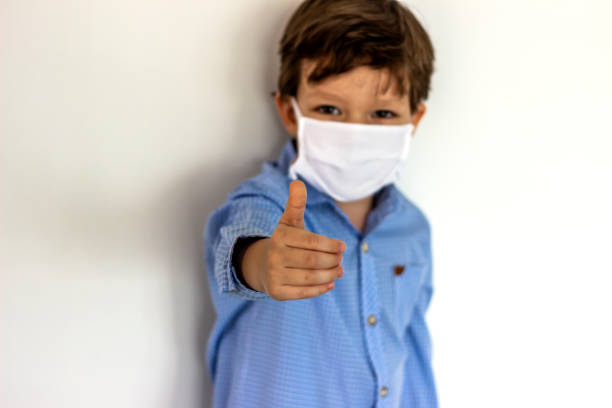 istock Little boy wearing mask,show thumbs up. 1226266906