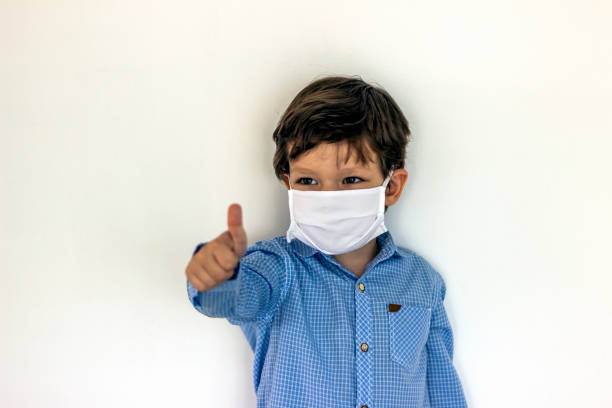 istock Little boy wearing mask,show thumbs up. 1226266928