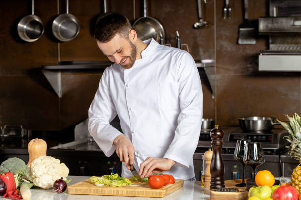 istock young chef-cook cut vegetables in kitchen 1226267234