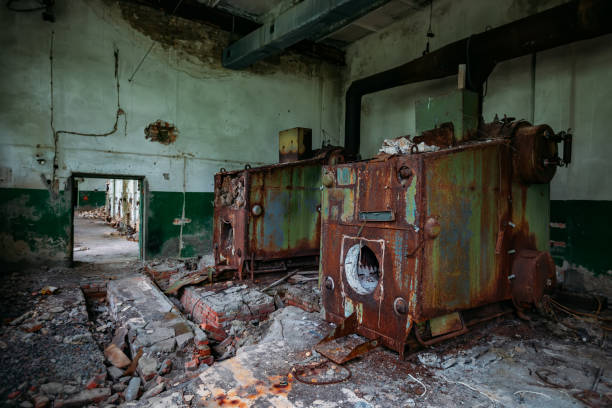 istock Old abandoned boiler room with rusty remnants of equipment 1226267455