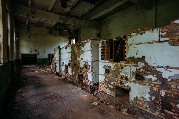 istock Old abandoned boiler room with rusty remnants of equipment 1226267457