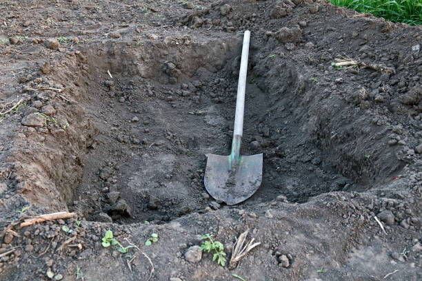 istock Digging a pit. The shovel lies in the pit. 1226268025