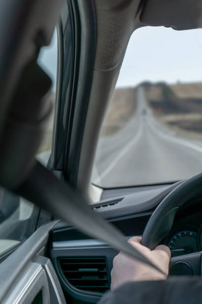 istock driver rides on the road by car 1226268484