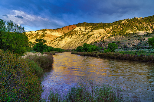 Colorado River at Sunset - Canyon view with warm sunset reflections.