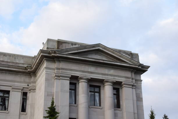 istock Facade Of Sandstone Building With Columns And Windows On A Cloudy Morning 1226273408