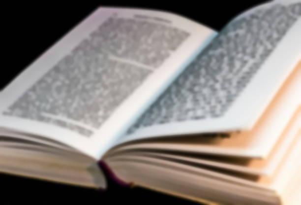 istock Open Talmud Torah Tanakh Book with English translation on table. Blurred view 1226273426
