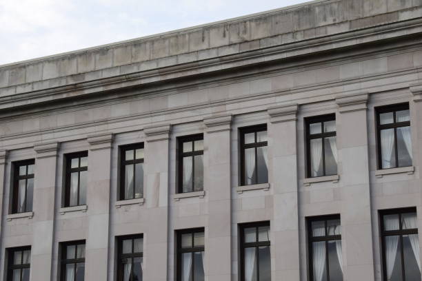 istock Angled View Of Beautiful Neoclassical Sandstone Building With Windows And Curtains 1226273510