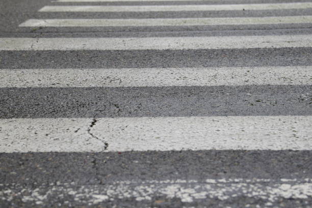 istock Close Up Of Stripped Crosswalk After Rainstorm 1226273572