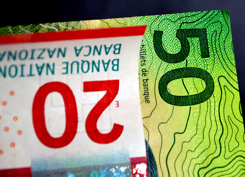 Colorful Swiss banknotes close up.