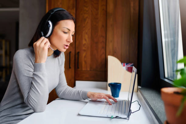 istock Young Woman Working from Home as an Online Support 1226275875